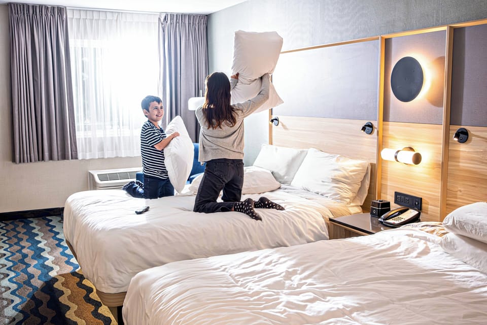 Premium bedding, pillowtop beds, desk, blackout drapes