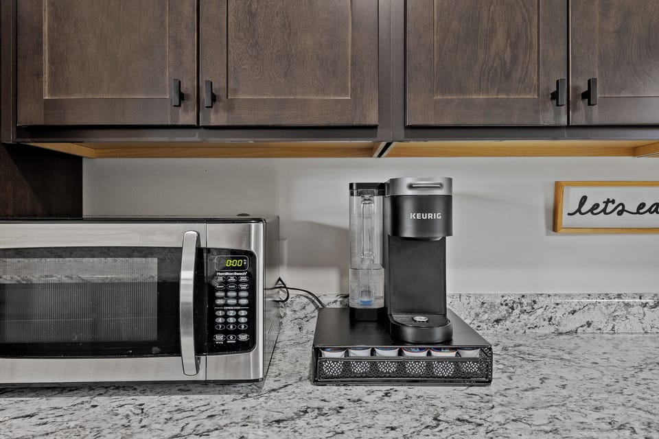 Keurig coffee maker with Keurig pods provided. 