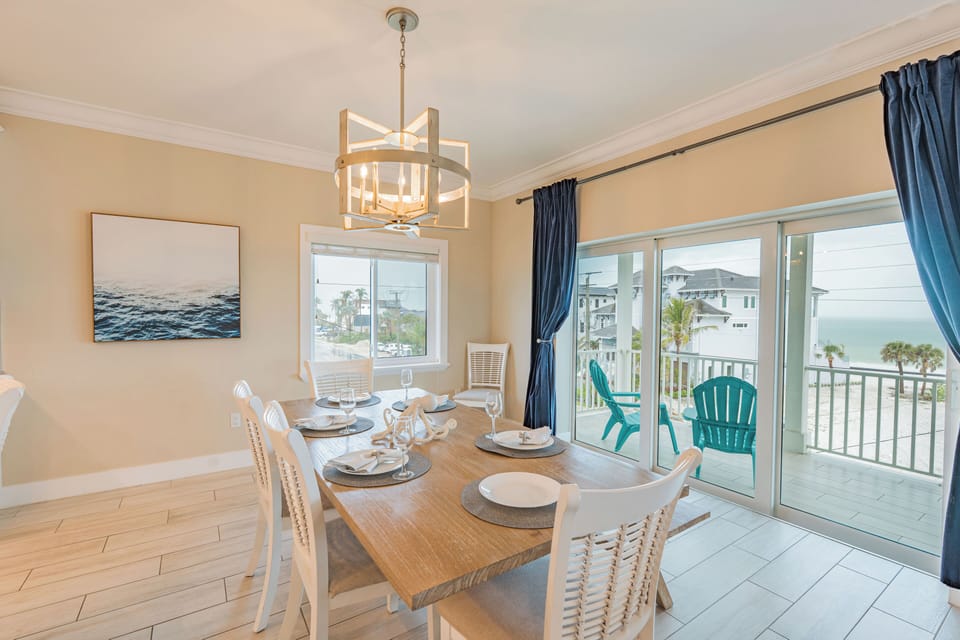 Enjoy meals with a view through the large glass lanai doors, filling the space with natural light and offering a serene backdrop of palm trees and ocean breezes.