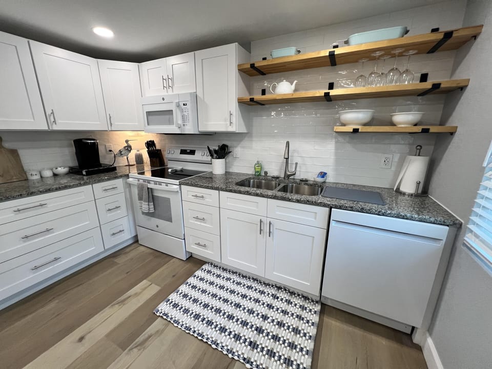Kitchen Features open shelving, Dishwasher