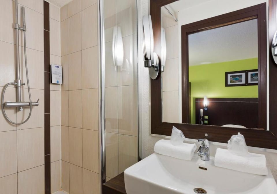 Shower, eco-friendly toiletries, hair dryer, towels