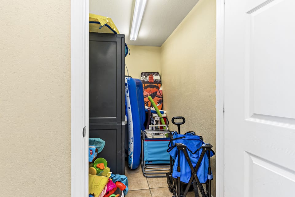 Front closet with beach cart, cooler, inflatables, etc..