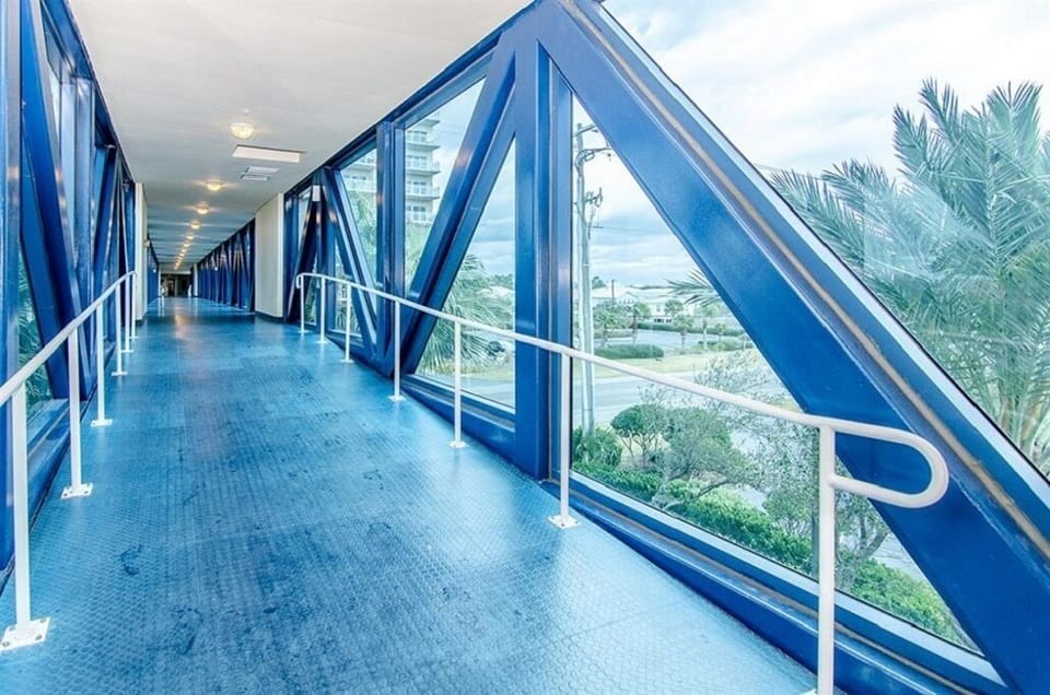 air conditioned skywalk to the other outside pool and beach