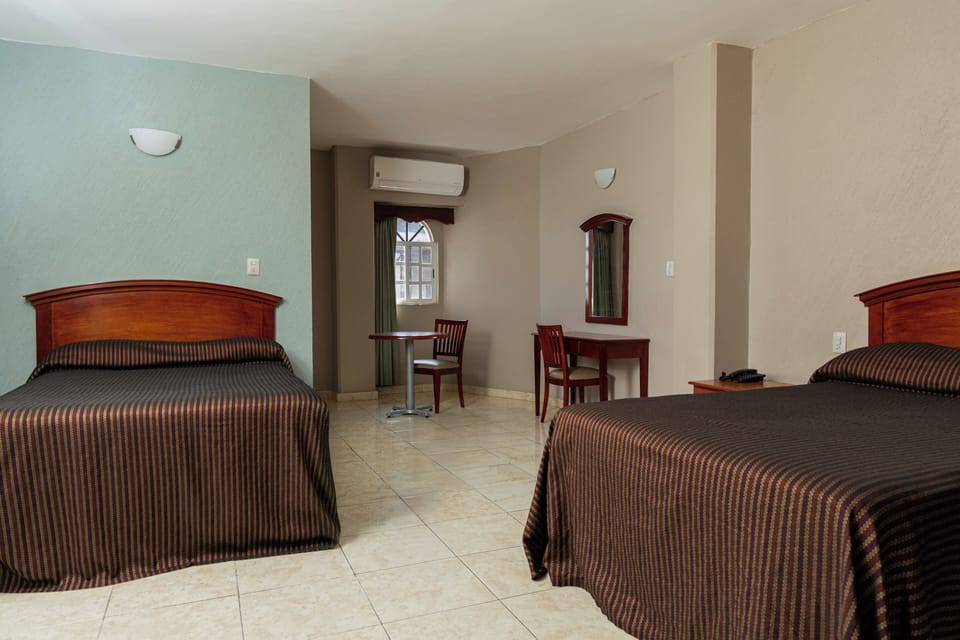 Room, 2 Double Beds | Desk, laptop workspace, WiFi (free), bed sheets