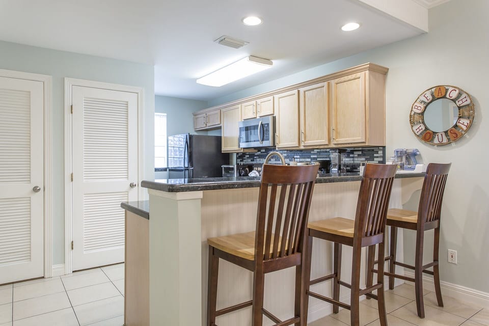Casual bar seating and a full dining table make mealtime easy and relaxed.
