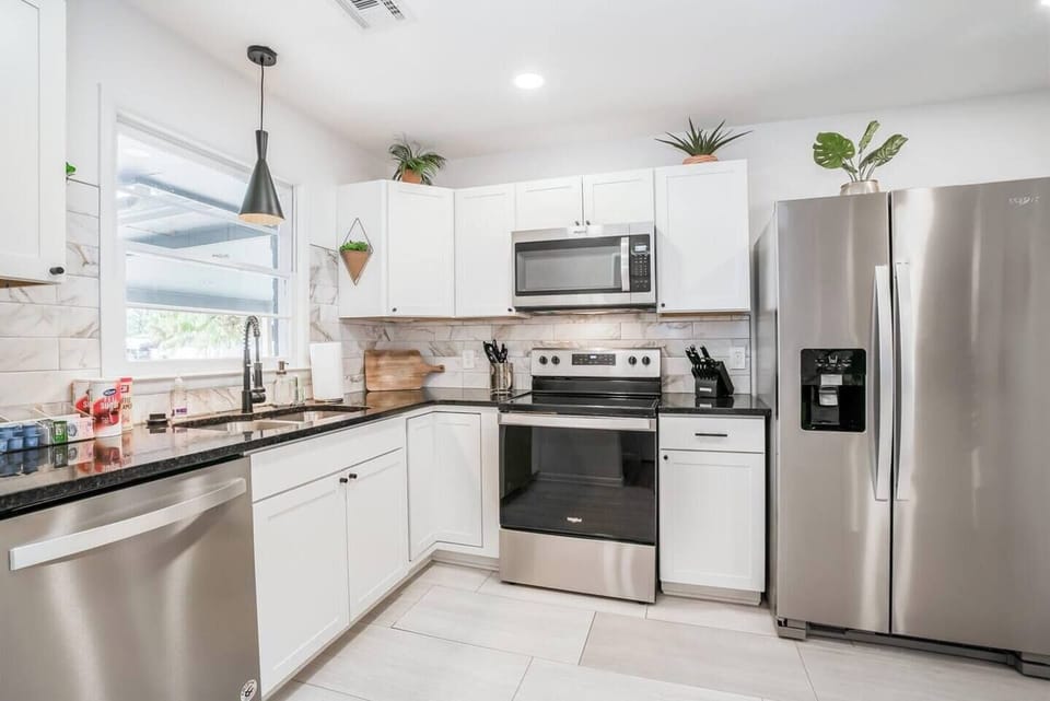 Remodeled kitchen with functional filtered water and ice machine, stainless steel appliances