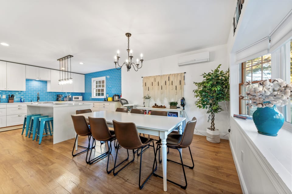Dining area with lots of board games, seating for 11 including the island 