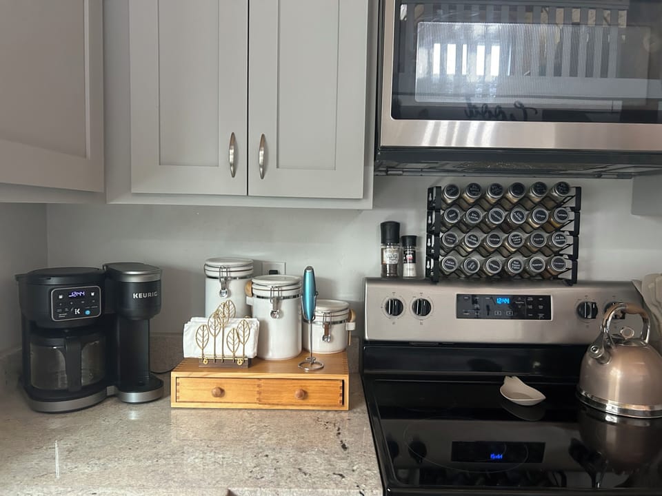 Hot beverage station and fully stocked spices.