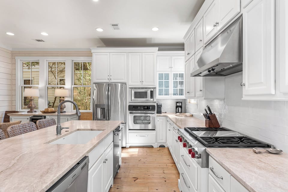 Recently remodeled kitchen with Wolf gas cooktop and new countertops