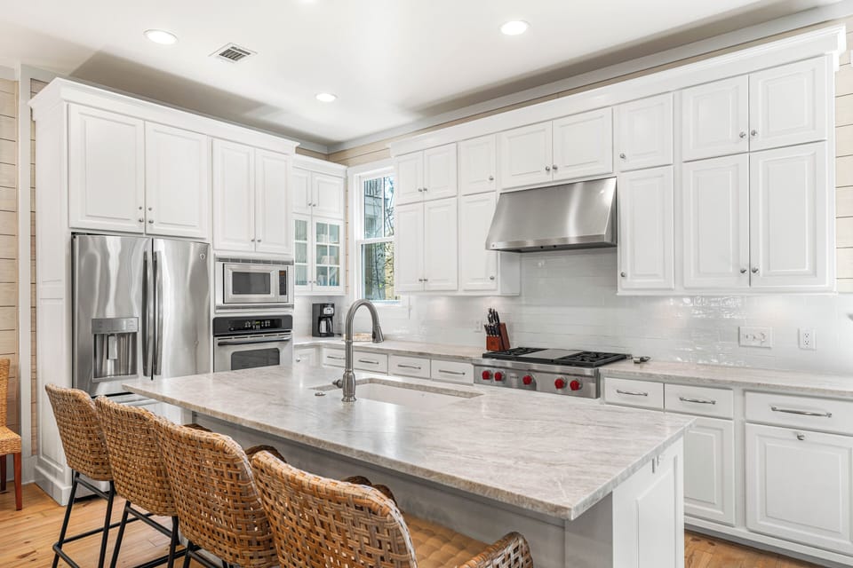 Recently remodeled kitchen with Wolf gas cooktop and new countertops