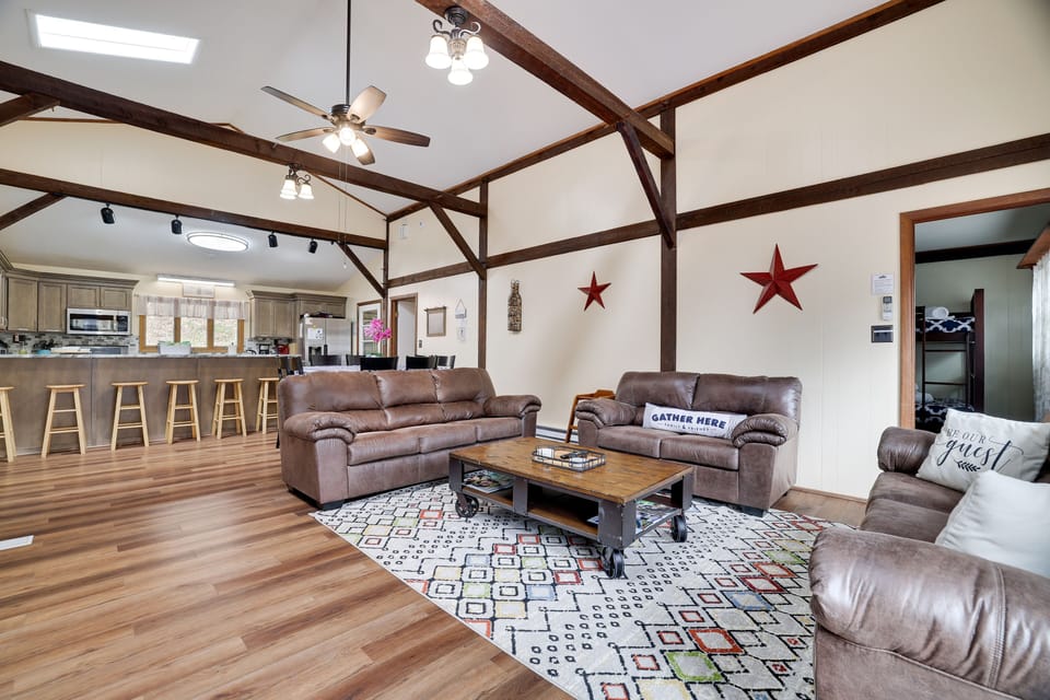 Huge, open concept living room with wood burning fire place and cable TV 