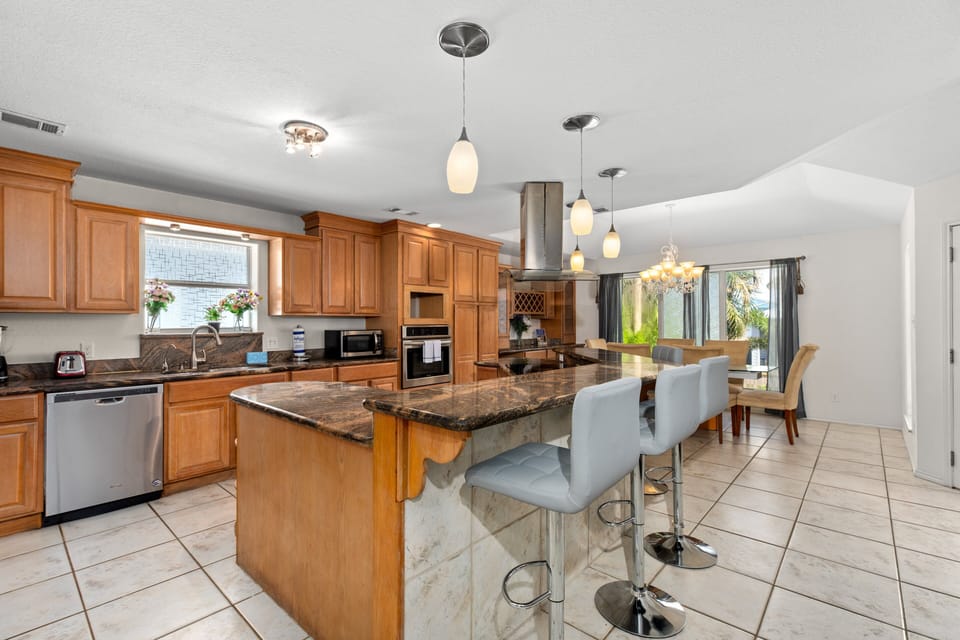 Fully stocked Kitchen area with extra bar space!