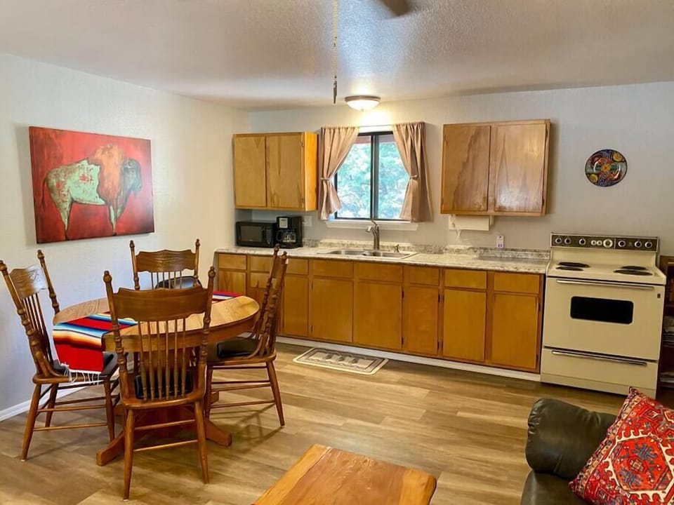 Full kitchen for your family meals with refrigerator, stove/oven, microwave, coffee pot, and toaster