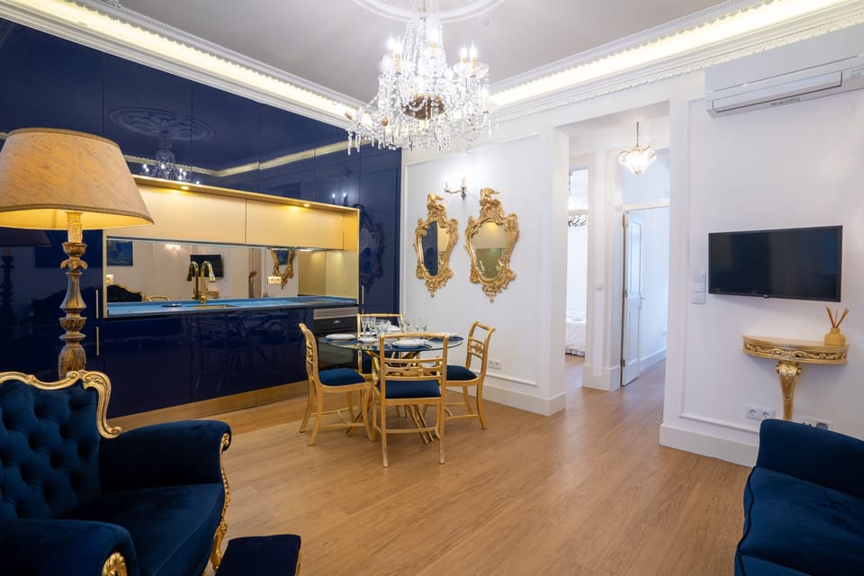 The kitchen surprises you with its golden Baroque style