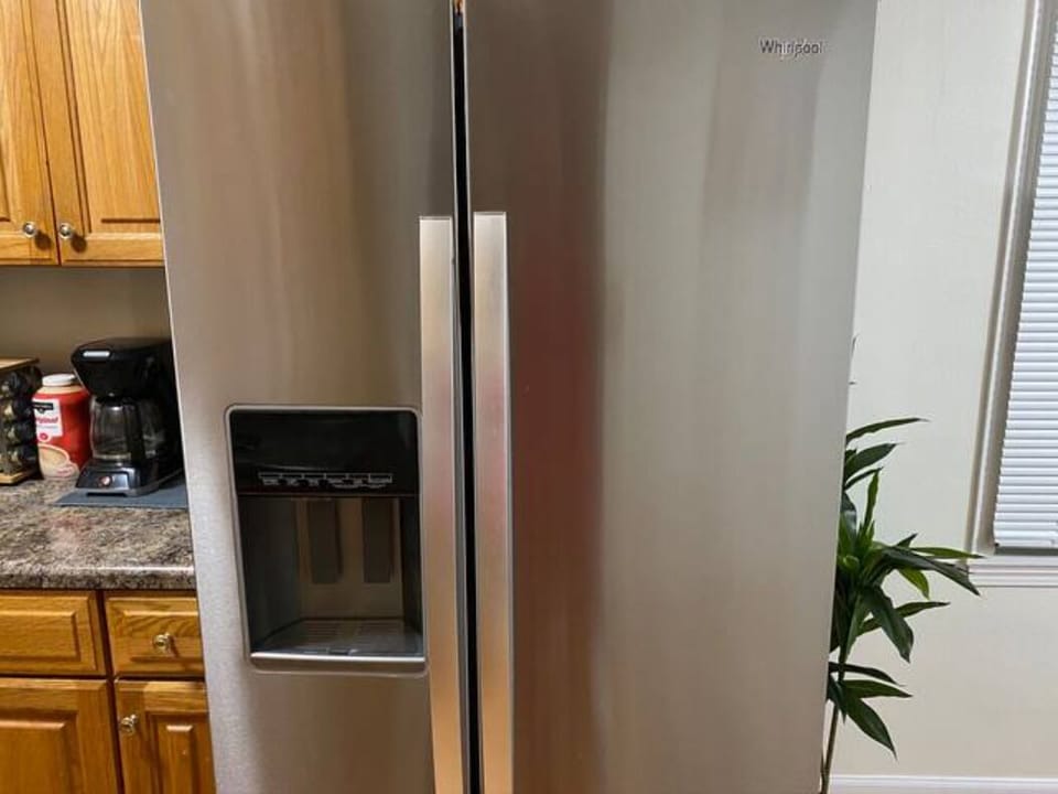 Enjoy the new Stainless fridge with convenient front ice and water. 