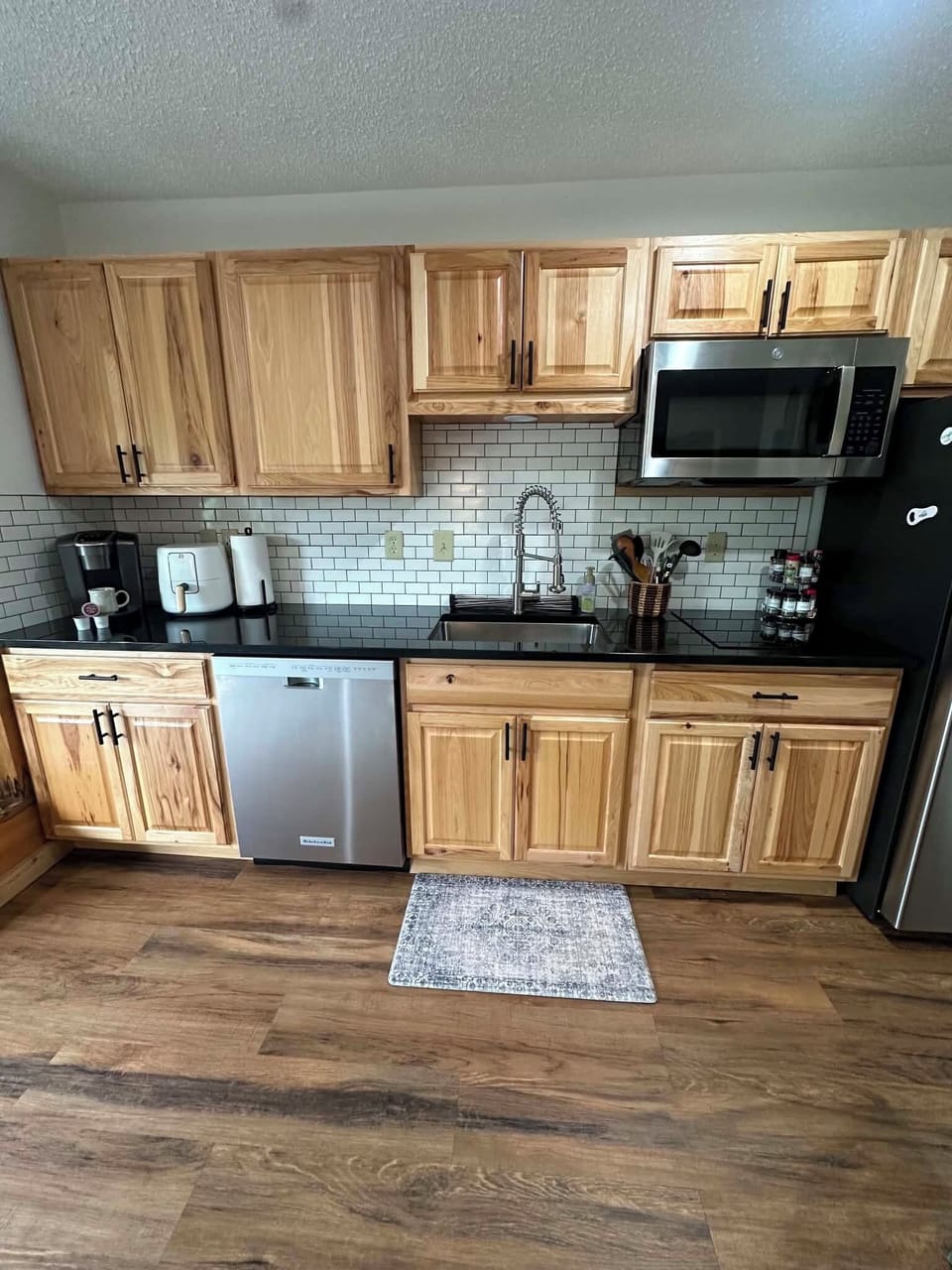 microwave,  coffee maker, refrigerator, stovetop. dishwasher