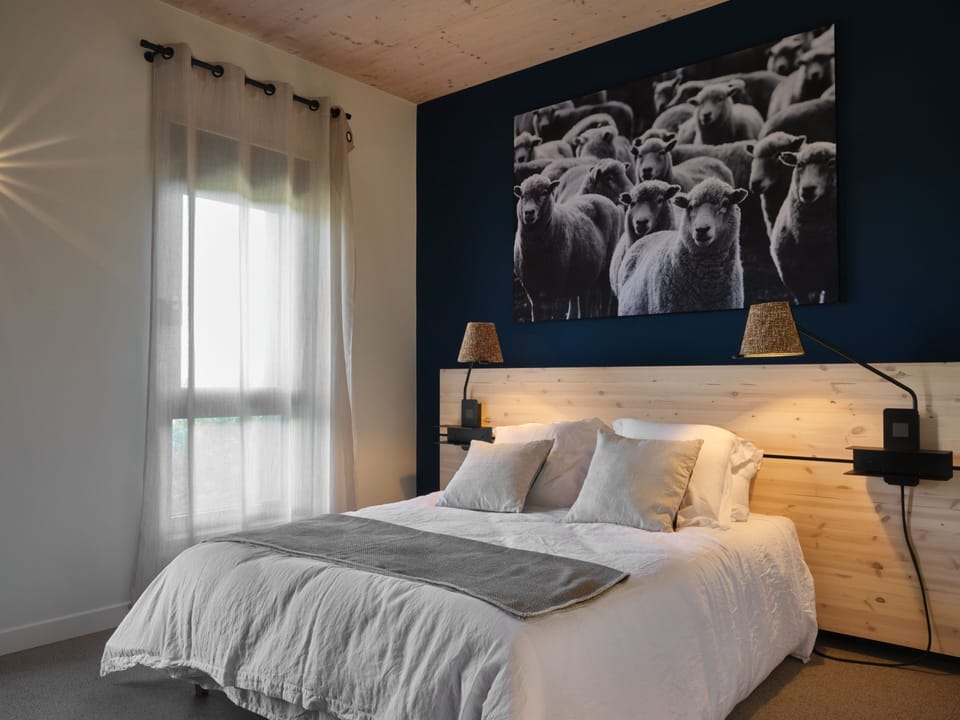 Premium bedding, desk, laptop workspace, soundproofing