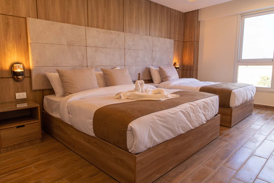 Suite with balcony pyramids view | Premium bedding, down comforters, Select Comfort beds, minibar
