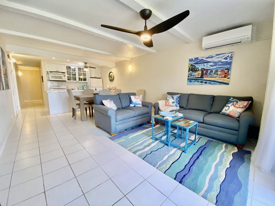 The comfy living room with balcony access, cold AC, amd flat screen TV