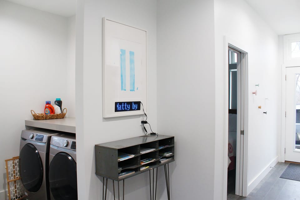 Bright entrance corridor with easy access to laundry, two bedrooms, and bath!