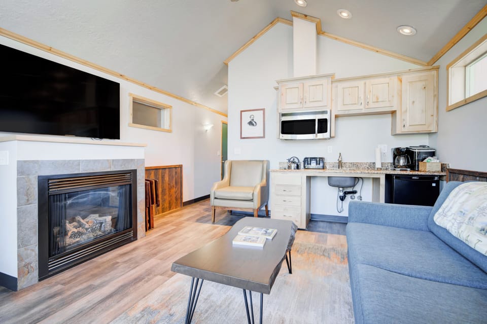 Cabin, 1 King Bed, Accessible (Old Faithful Cabin) | Living area | Flat-screen TV