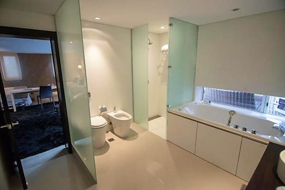 Suite | Bathroom | Deep soaking tub, rainfall showerhead, free toiletries, hair dryer