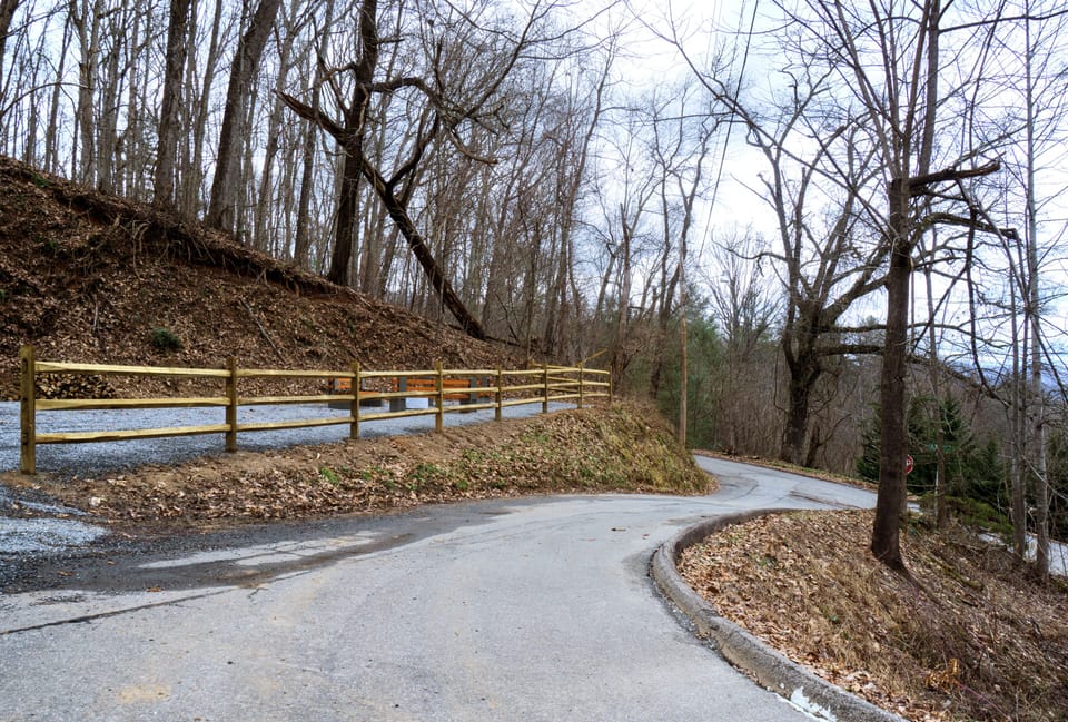 Paved road leading up to the house. The fenced in area is the fire pit area.