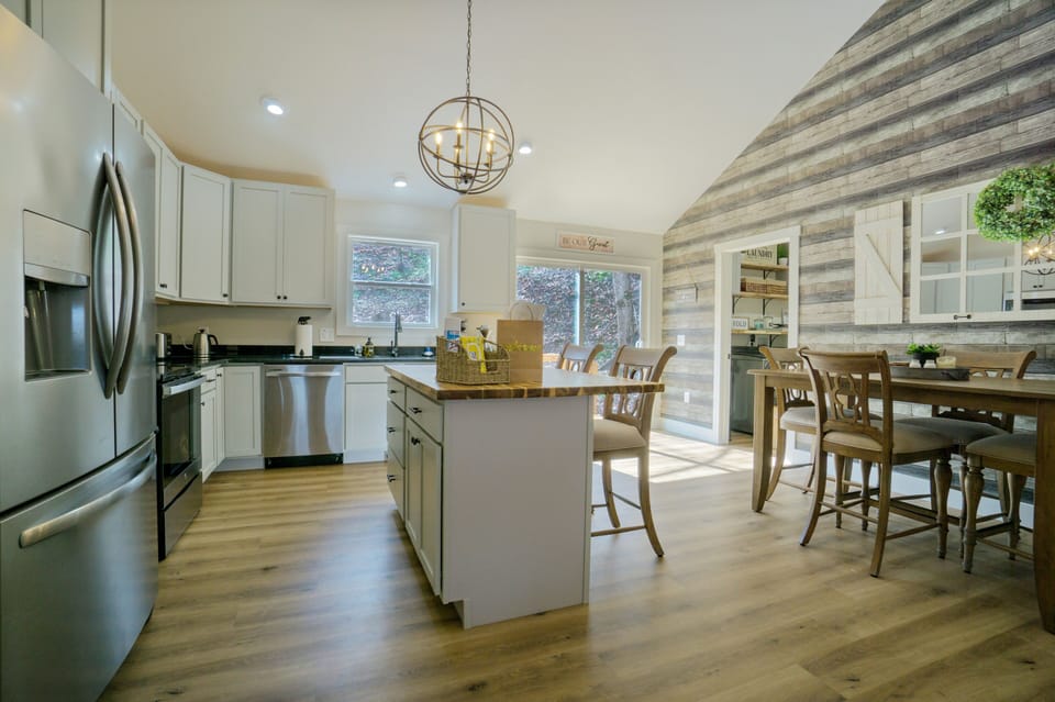 Kitchen/dining areas. The 2 chairs at the island can fit at the dining table.