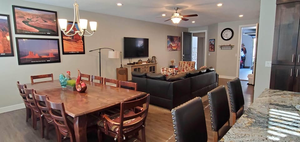 Main Living Area, New Different Leather Couch, Large Smart TV, 5G & Nice Artwork