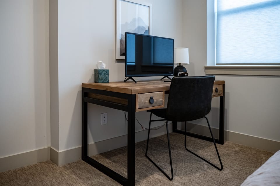 There is a work area, complete with desk, chair and monitor, located in the second bedroom.
