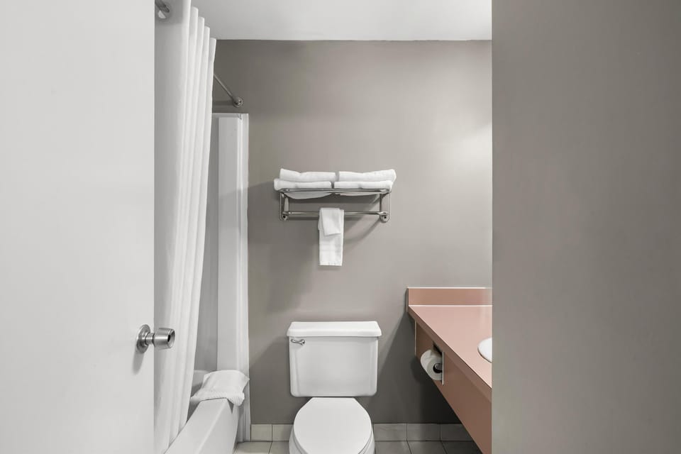 Room, 2 Queen Beds | Bathroom | Combined shower/tub, free toiletries, hair dryer, towels