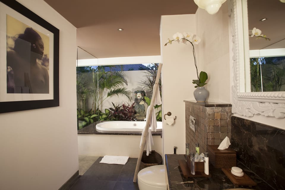 Signature Suites - Adult Only | Bathroom | Shower, free toiletries, bathrobes, slippers