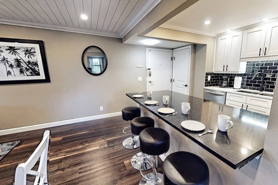 Granite kitchen bar extended to seat four people....chat up with the chef in the family!