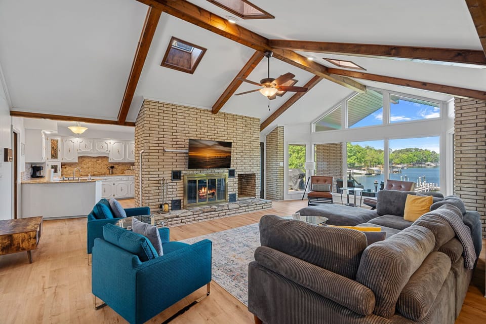 Large living room with tons of seating & lake views.