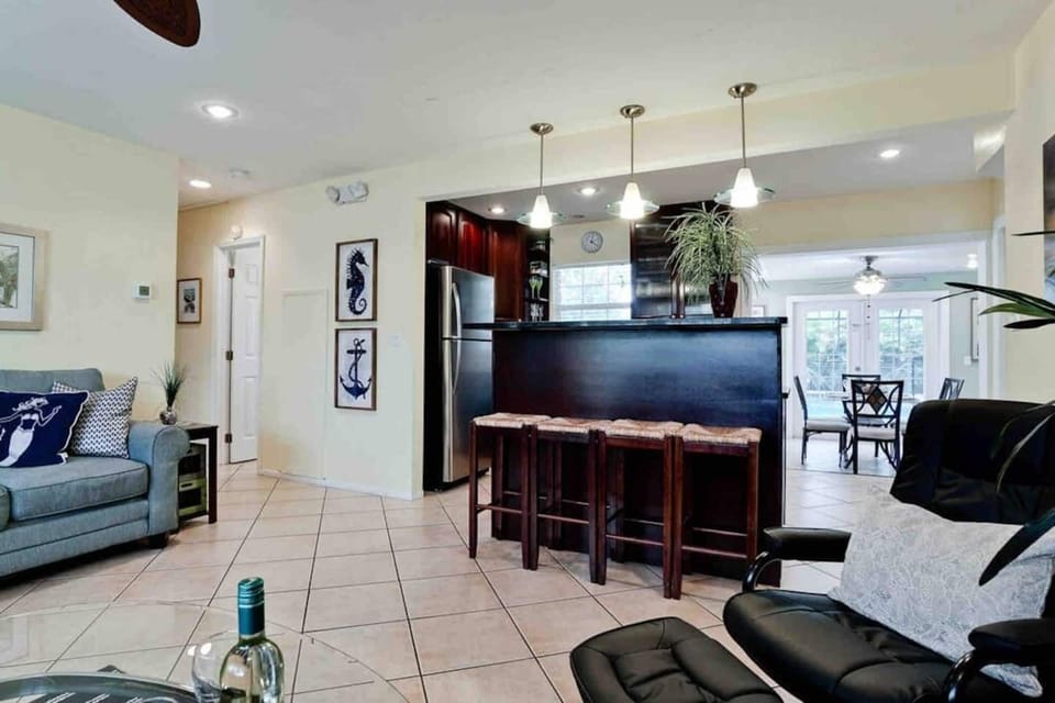 Open-concept family room delights guests and offers plenty of casual seating options 