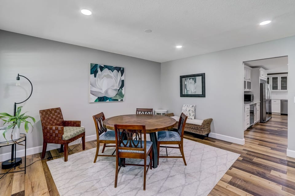 Living Area with Flat Screen TV, Gas Log Fireplace, and Breakfast Table with Seating for Four
