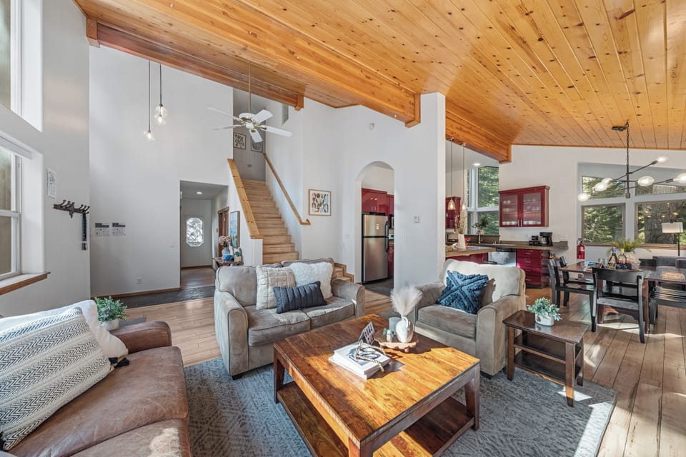 Relax in the sun-filled living room with vaulted ceilings and mountain-lodge charm.