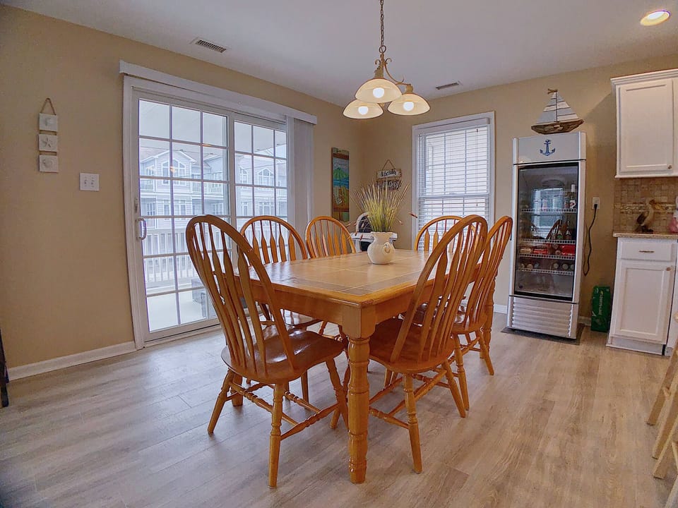 Dinning area - Dinning Area please note the beverage refrigerator and sliding patio doors to out side deck/patio