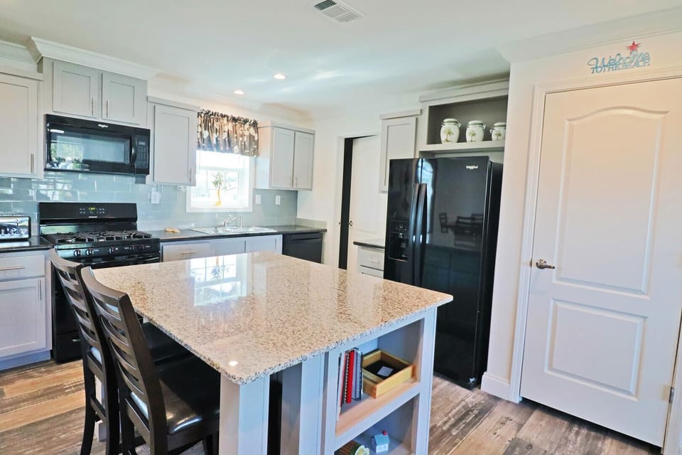 The fully equipped kitchen is perfect for preparing a family dinner or just a quick bite for lunch.
