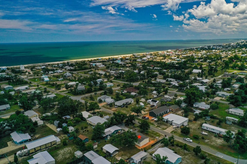Aerial view of the Gulf with the property location in the foreground.