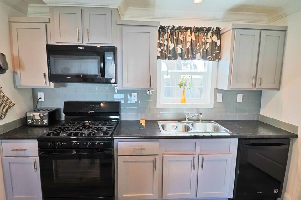 This kitchen features a gas range.