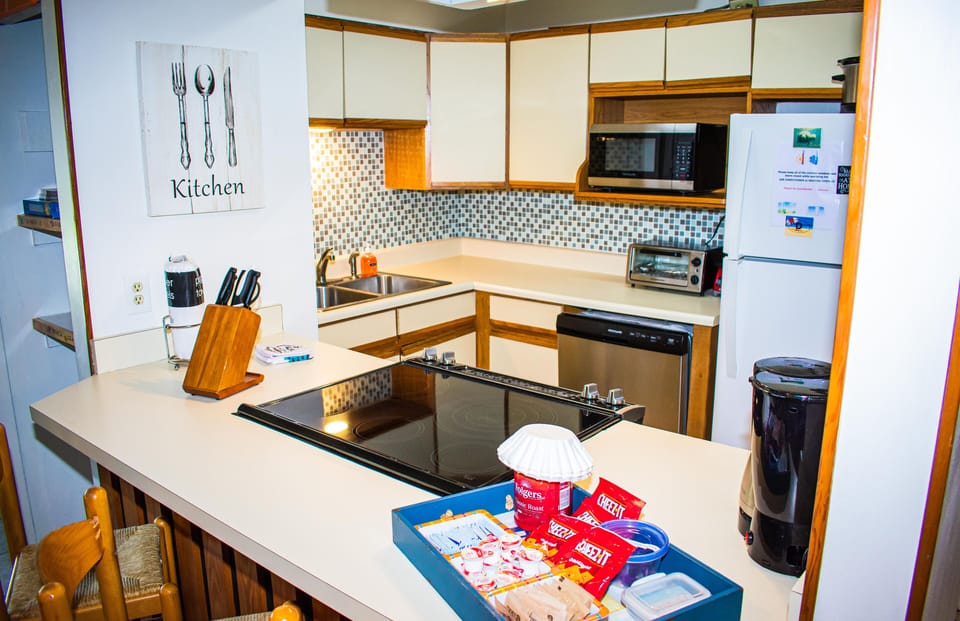 Fully stocked kitchen with additional utensils, tools and supplies