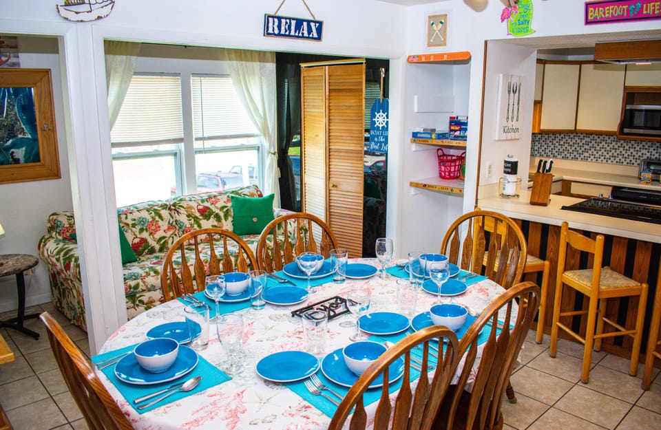 Dining area for 8 people, complete with full silverware and dining sets