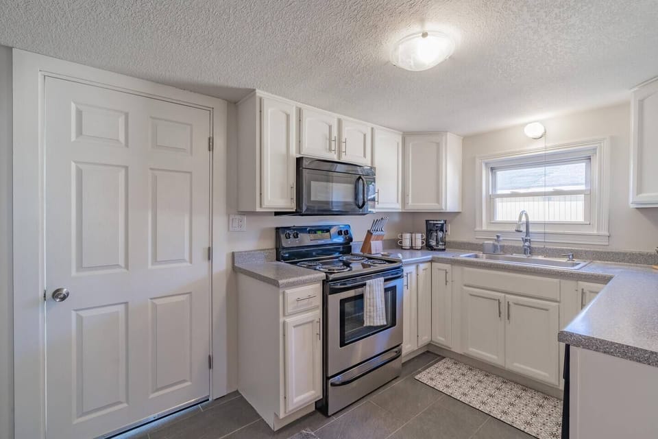 Traditional drip coffee maker, electric range, and over the range microwave!