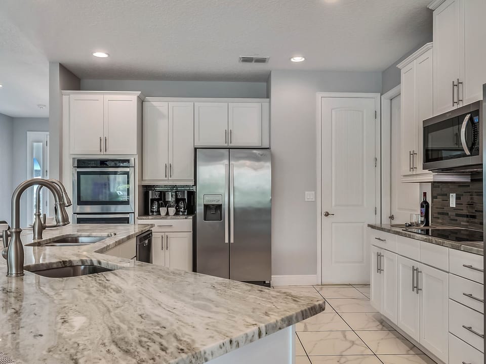 - Modern kitchen with granite countertops and island  
- Stainless steel appliances for easy family meals  
- Spacious layout perfect for cooking together