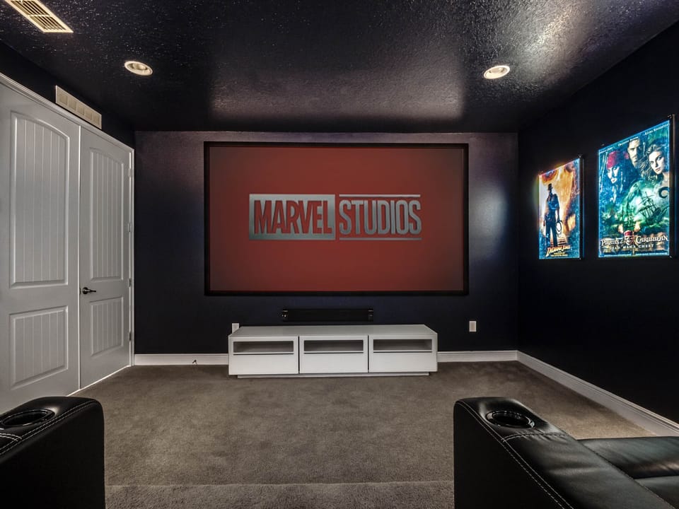 - Private theater with large screen and surround sound  
- Recliner seating for the perfect movie night setup  
- Family fun with posters and cinematic experience