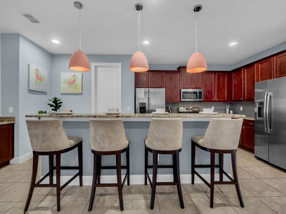 - Spacious kitchen with granite counters and bar seating for group dining  
- Modern appliances and bright pendant lights make cooking enjoyable  
- Perfect layout for family stays and vacation gatherings with friends