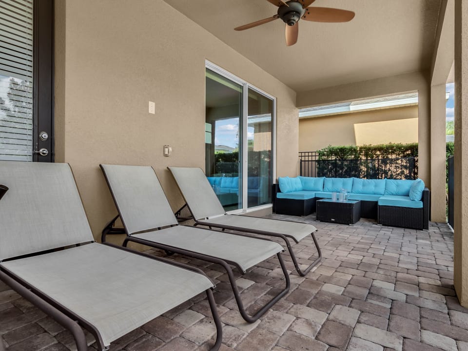 - Outdoor covered patio with lounge chairs and shaded seating for relaxation  
- Enjoy the fresh air while gathering with family and friends  
- Perfect outdoor living space for group-friendly vacation rentals