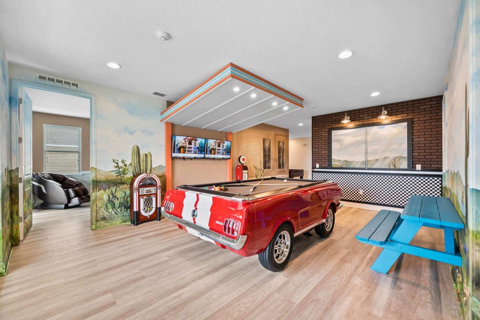 - Retro game room with classic car pool table and jukebox vibe  
- Wall art and vibrant decor create a nostalgic entertainment space  
- Fun hangout with TV screens perfect for group gatherings