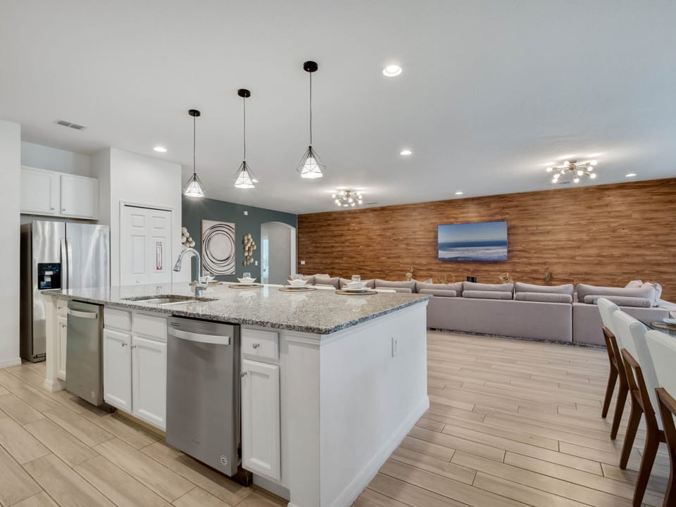 - Bright open kitchen with granite island and pendant lighting  
- Fully equipped with modern appliances and cookware essentials  
- Perfect hub for shared meals and family vacation gatherings